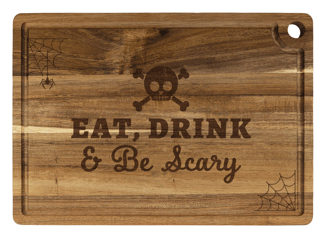 Personalized cutting board engraved with Eat, Drink & Be Scary