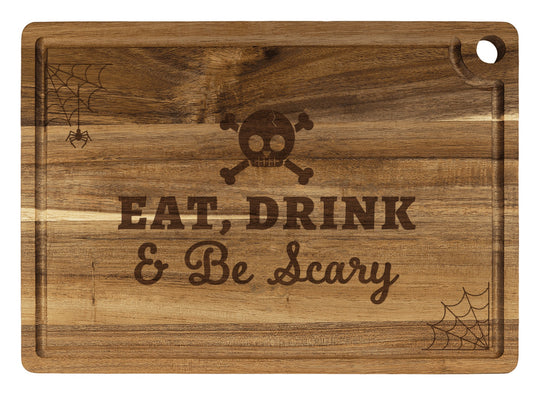 Personalized cutting board engraved with Eat, Drink & Be Scary