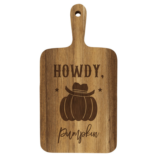 Personalized paddle cutting board engraved with Howdy Pumpkin, a pumpkin in a cowboy hat