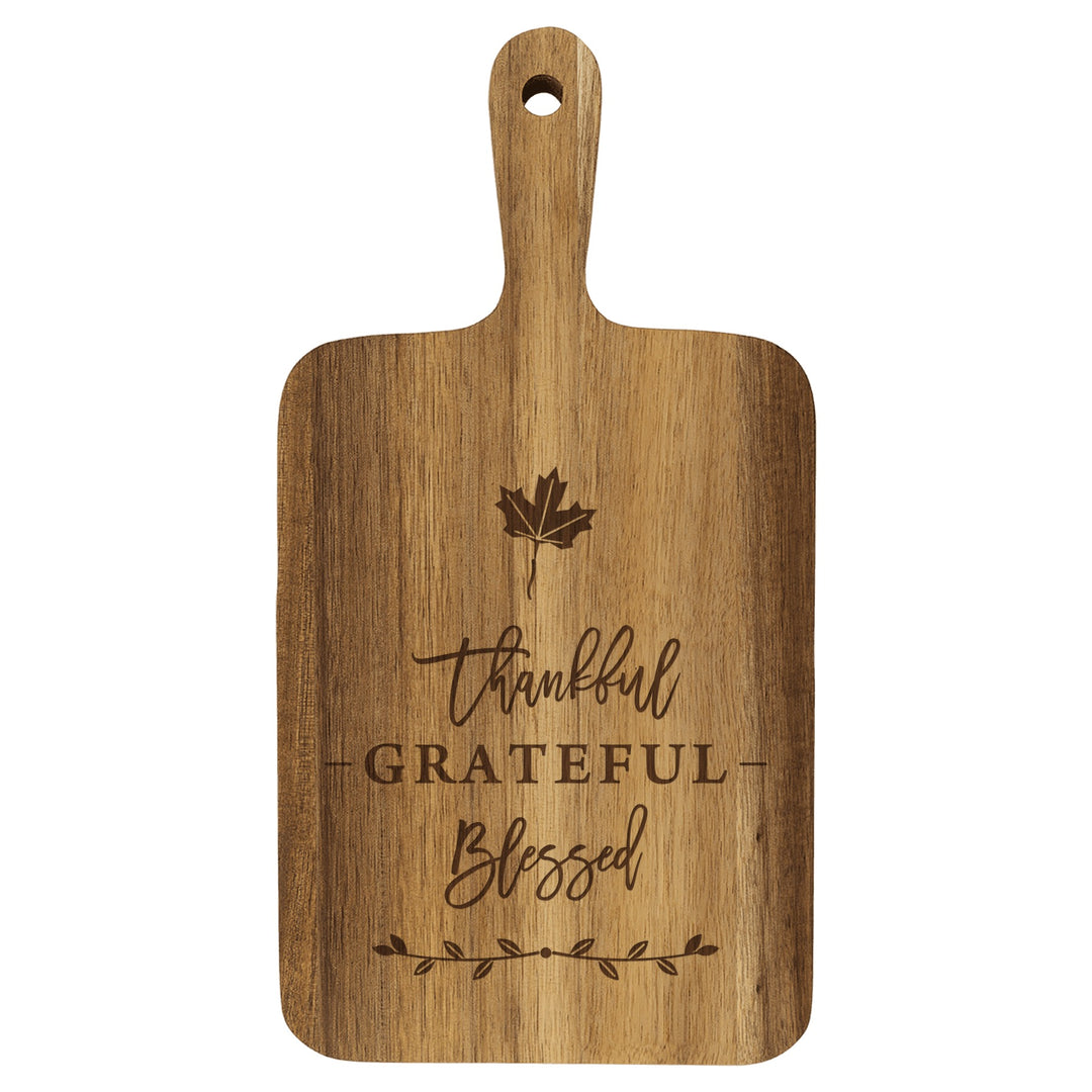 Personalized paddle cutting board engraved with Thankful, Grateful, Blessed and a maple leaf
