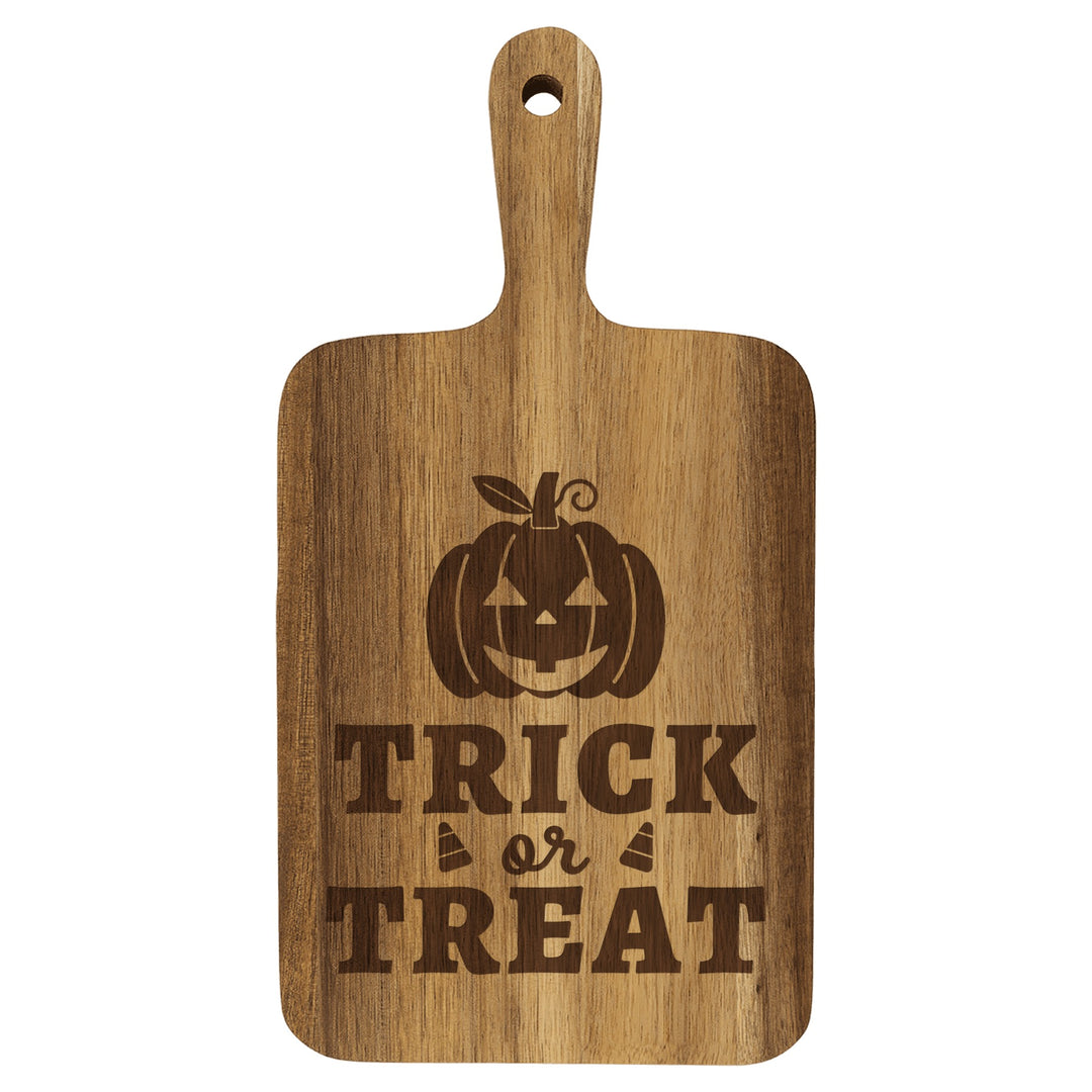 Personalized paddle cutting board engraved with Trick or Treat